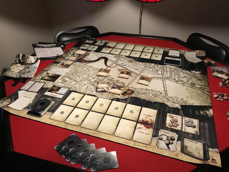 Arkham Horror LCG solo setup - cards spread across a table for solo play